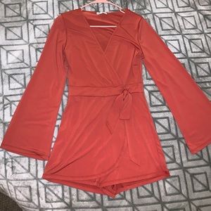 Burnt orange long-sleeve romper. Charlotte Russe, size small.
